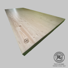 Close-up of Mod-G dining table showing natural spruce grain and FG Handcrafted Elegance branding