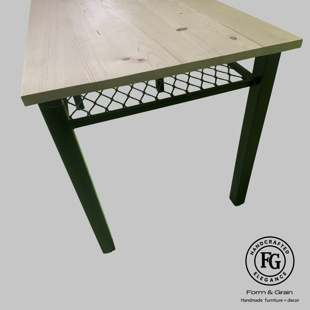 StudioMesh Desk with solid spruce top, steel legs and mesh storage shelf by Form & Grain.